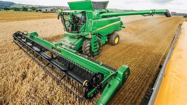 Tractor harvesting grain